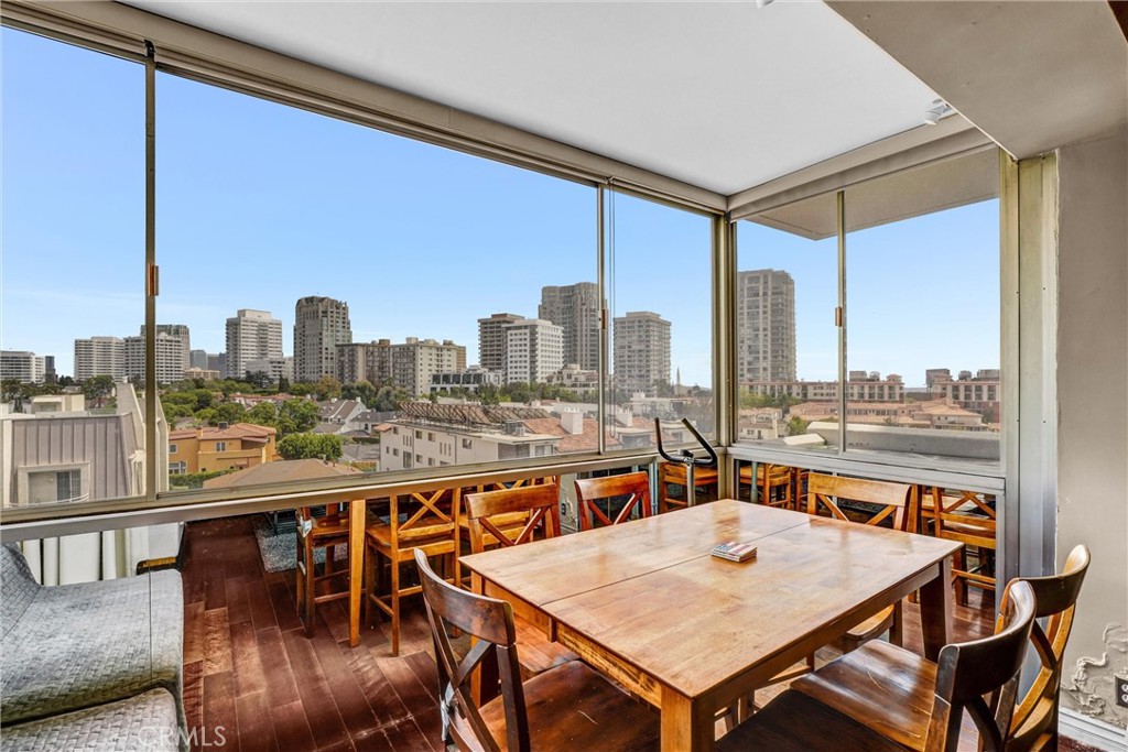 969 Hilgard Avenue, Unit 706 Los Angeles, CA 90024 - Photo 16 of 27 a view of a dining room with furniture window and wooden floor