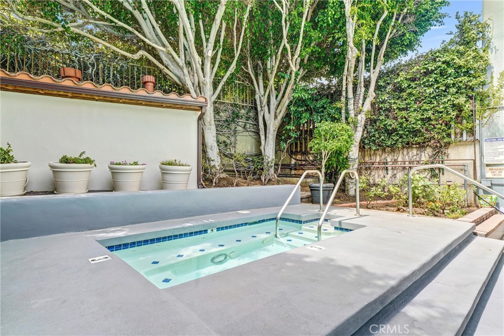 969 Hilgard Avenue, Unit 706 Los Angeles, CA 90024 - Photo 24 of 27 a view of a two chair and fire pit in the backyard