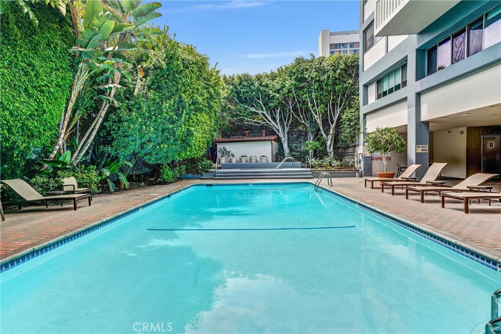 969 Hilgard Avenue, Unit 706 Los Angeles, CA 90024 - Photo 27 of 27 a view of a house with a swimming pool and sitting area