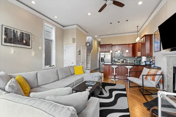 a living room with furniture and a flat screen tv