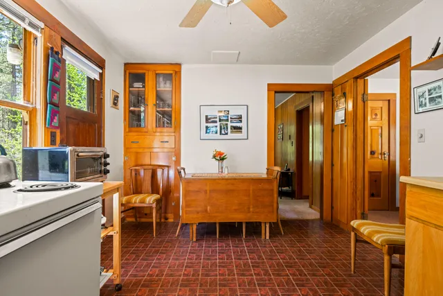 a view of dining room with furniture and window