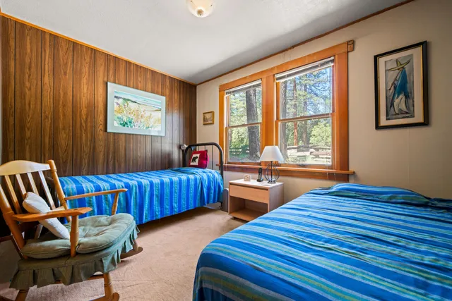 a bedroom with furniture and a window