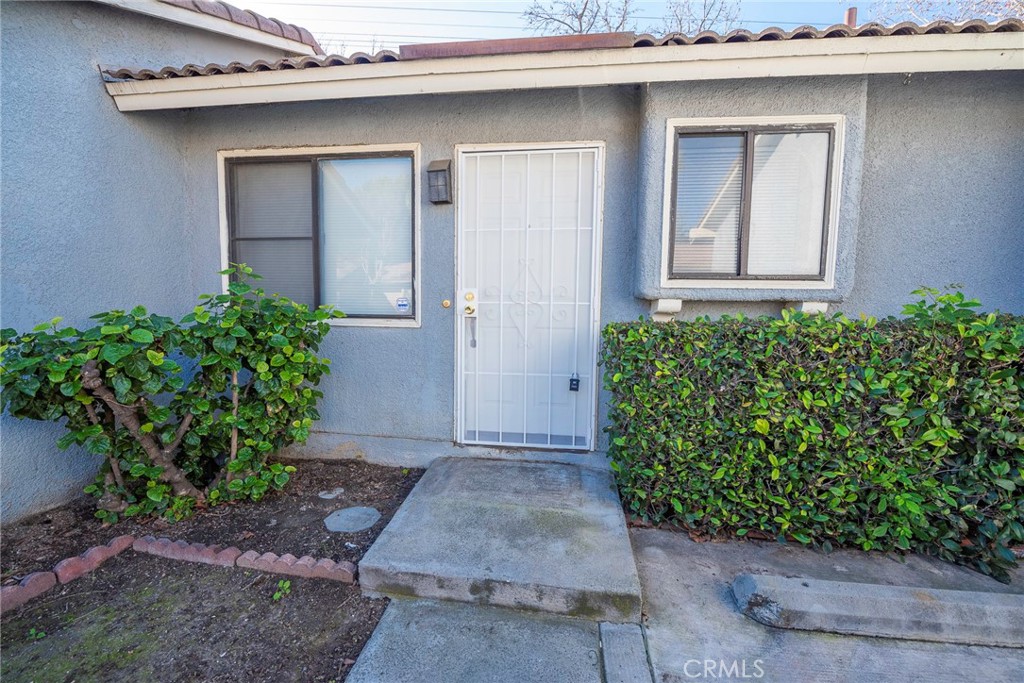 9505 Arlington Avenue, Unit 70 Riverside, CA 92503 - Photo 1 of 1 a front view of a house with garden