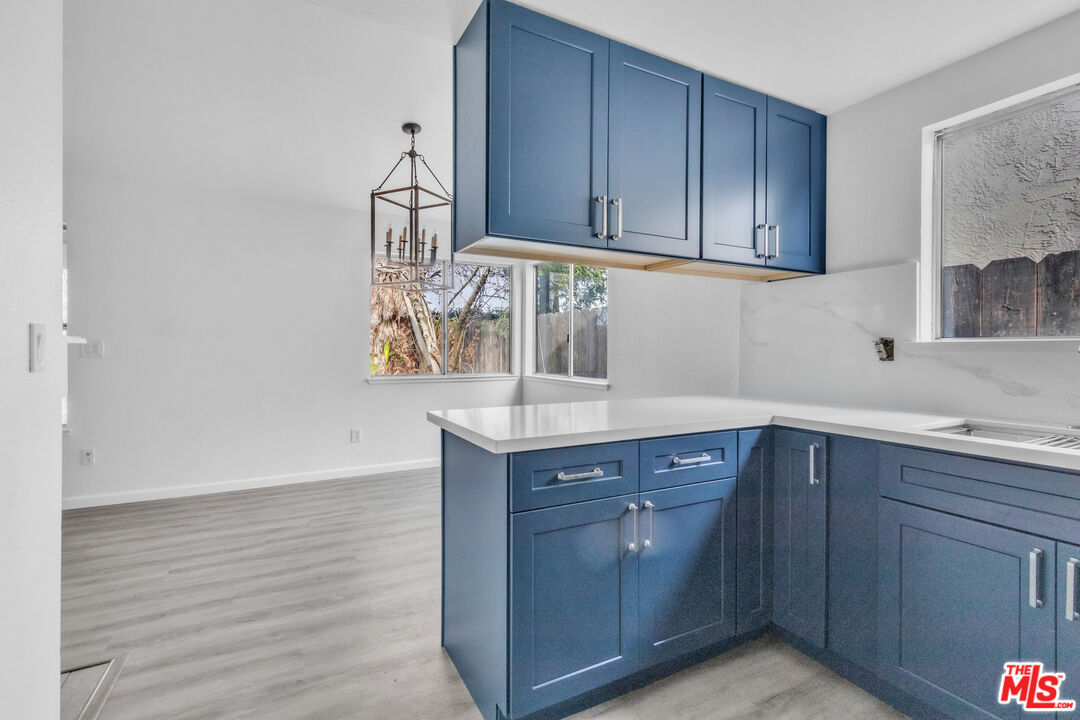 3401 Matterhorn Way Ceres, CA 95307 - Photo 19 of 33 a kitchen with wooden cabinets and sink