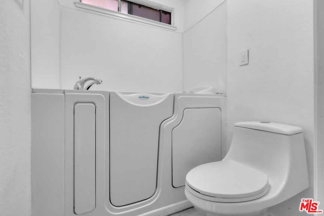 3401 Matterhorn Way Ceres, CA 95307 - Photo 31 of 33 a white toilet sitting next to a bathroom sink