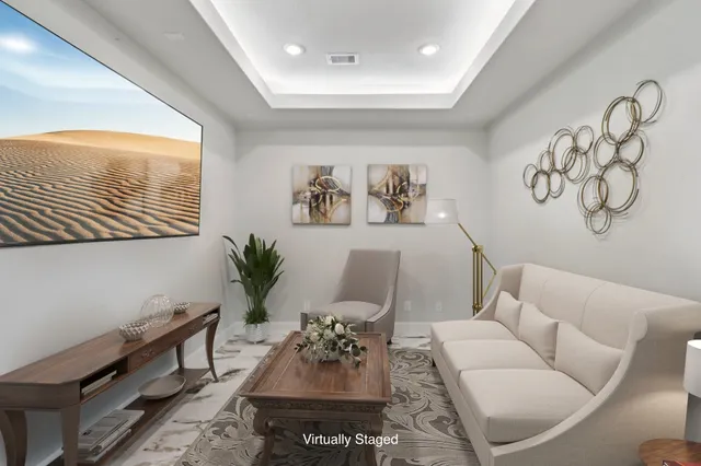 a front view of house with yard and trees around