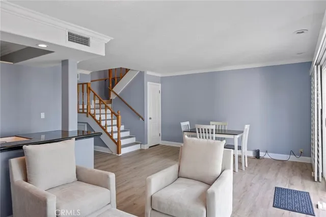 a living room with furniture and a painting