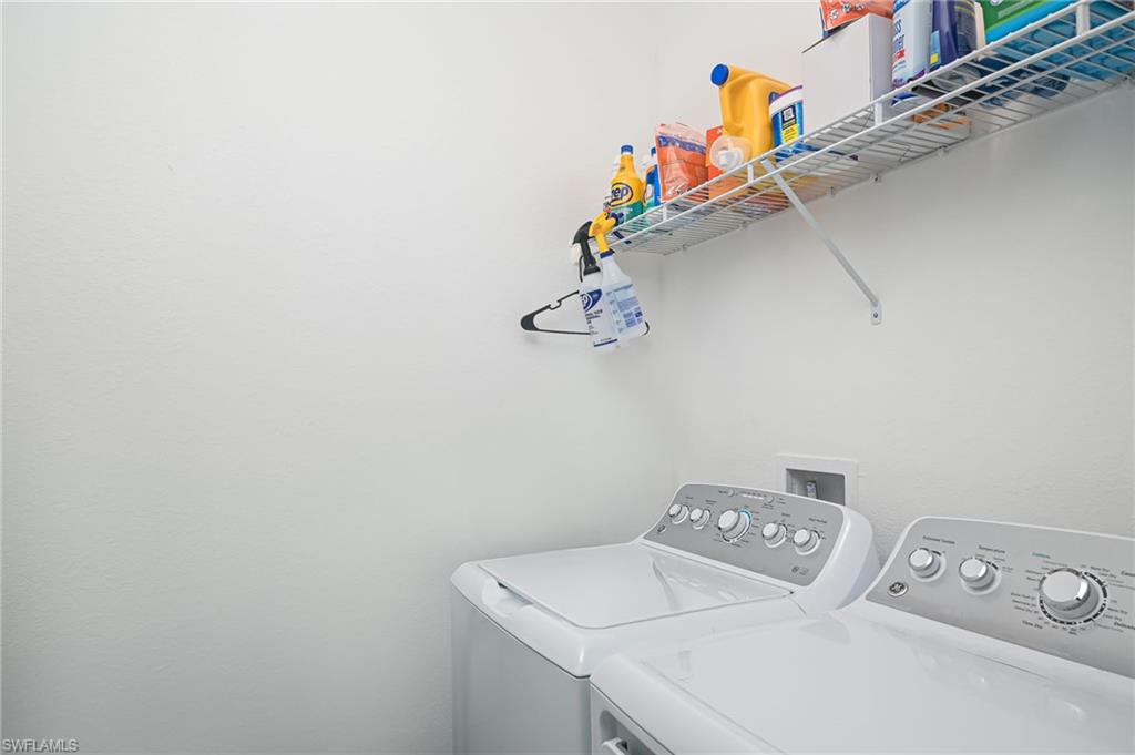 2073 Tamarron Lane Naples, FL 34120 - Photo 15 of 22 a utility room with dryer and washer