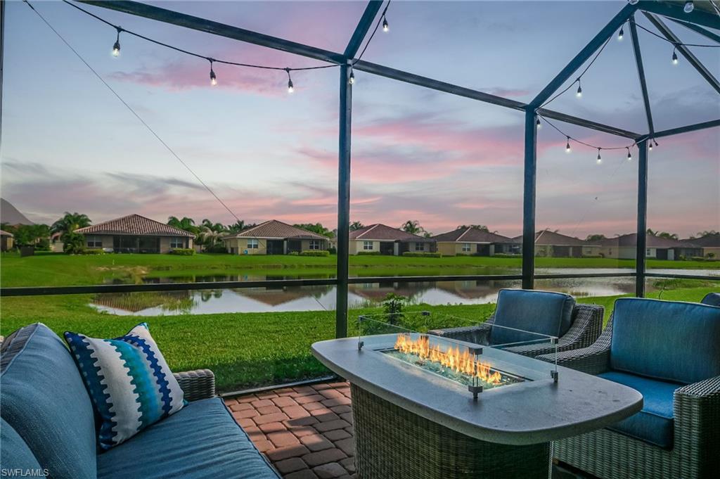 2073 Tamarron Lane Naples, FL 34120 - Photo 18 of 22 a view of swimming pool and lake view