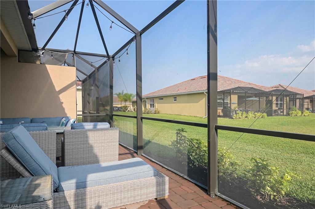 2073 Tamarron Lane Naples, FL 34120 - Photo 19 of 22 a balcony view with a ocean view