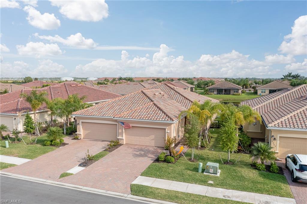 2073 Tamarron Lane Naples, FL 34120 - Photo 20 of 22 an aerial view of a house