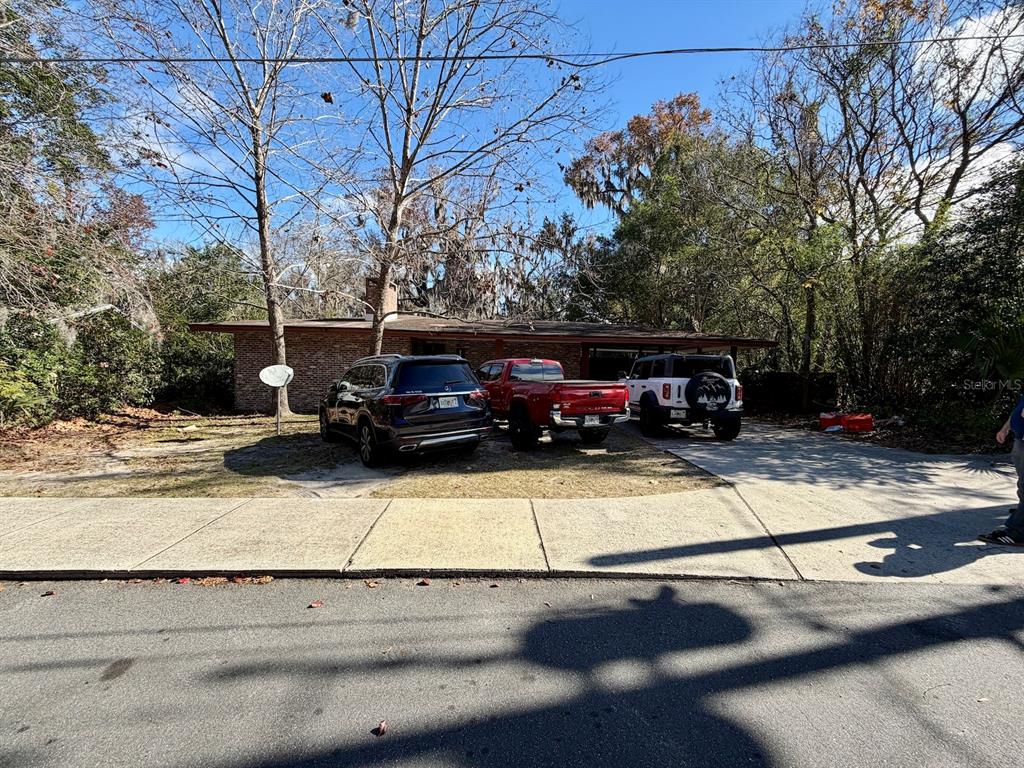 111 Southwest 23rd Terrace Gainesville, FL 32607 - Photo 3 of 22 a view of a street with cars