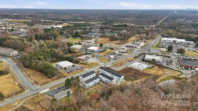 an aerial view of residential house with parking