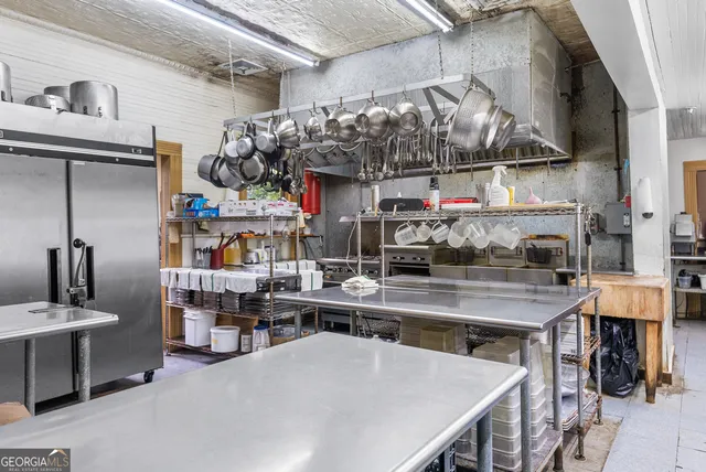 a view of a kitchen with appliances and cabinets