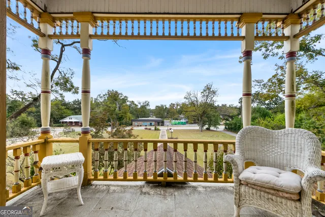 a view of a balcony with chairs