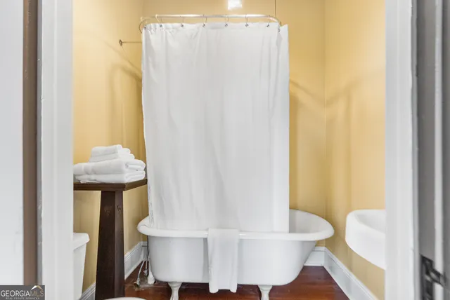 a living room with a table and a chair