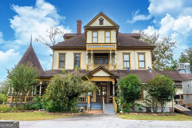 a front view of a house with garden
