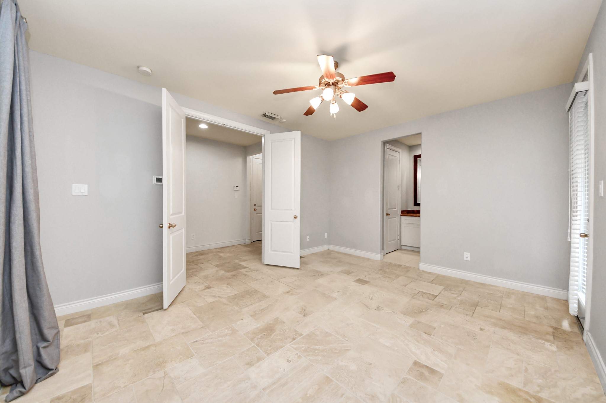 3422 Center Street Houston, TX 77007 - Photo 17 of 27 French doors lead to the first floor guest suite.
