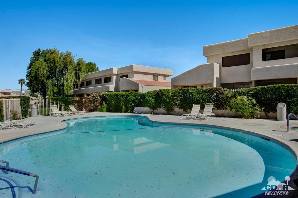 34041 Emily Way Rancho Mirage, CA 92270 - Photo 2 of 25 a front view of a house with swimming pool