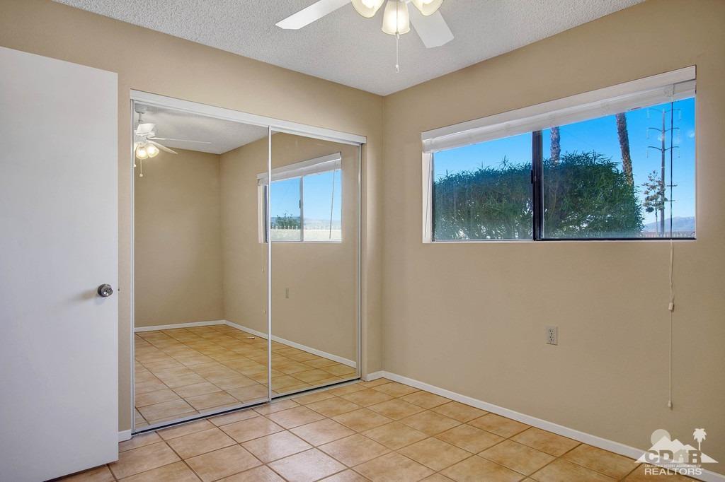34041 Emily Way Rancho Mirage, CA 92270 - Photo 17 of 25 a view of an empty room with a window