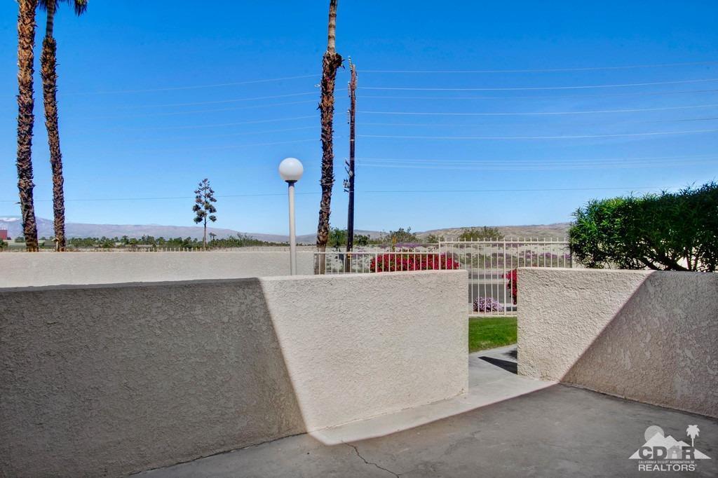 34041 Emily Way Rancho Mirage, CA 92270 - Photo 21 of 25 a view of a swimming pool with a yard