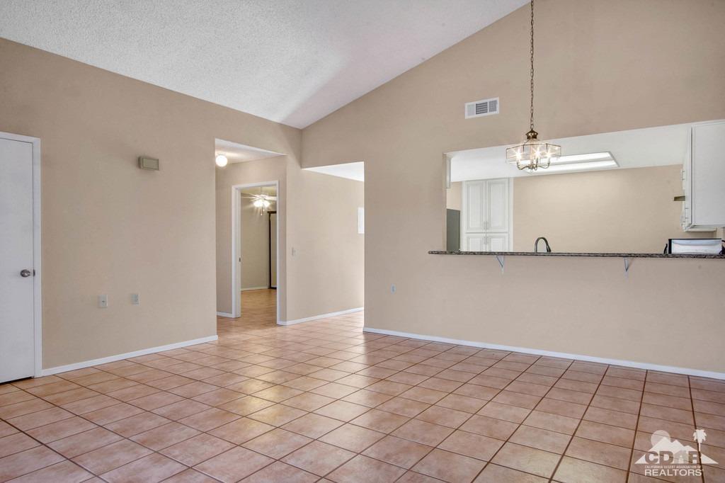 34041 Emily Way Rancho Mirage, CA 92270 - Photo 6 of 25 a view of a hallway with closet and chandelier fan