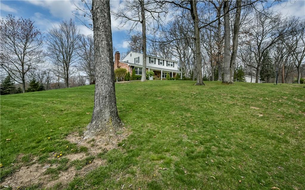 210 Woodcroft Road Economy, PA 15005 - Photo 2 of 25 Set in park like setting with mature trees and plenty of distance between neighbors.