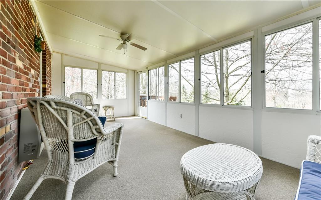 210 Woodcroft Road Economy, PA 15005 - Photo 12 of 25 Relax in this sun drenched sunroom and watch the birds from the mature trees in the backyard.