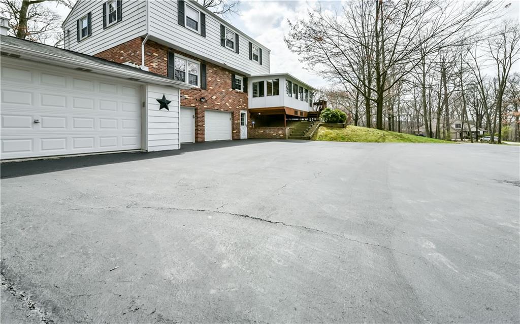 210 Woodcroft Road Economy, PA 15005 - Photo 21 of 25 Large driveway fits plenty of cars.
