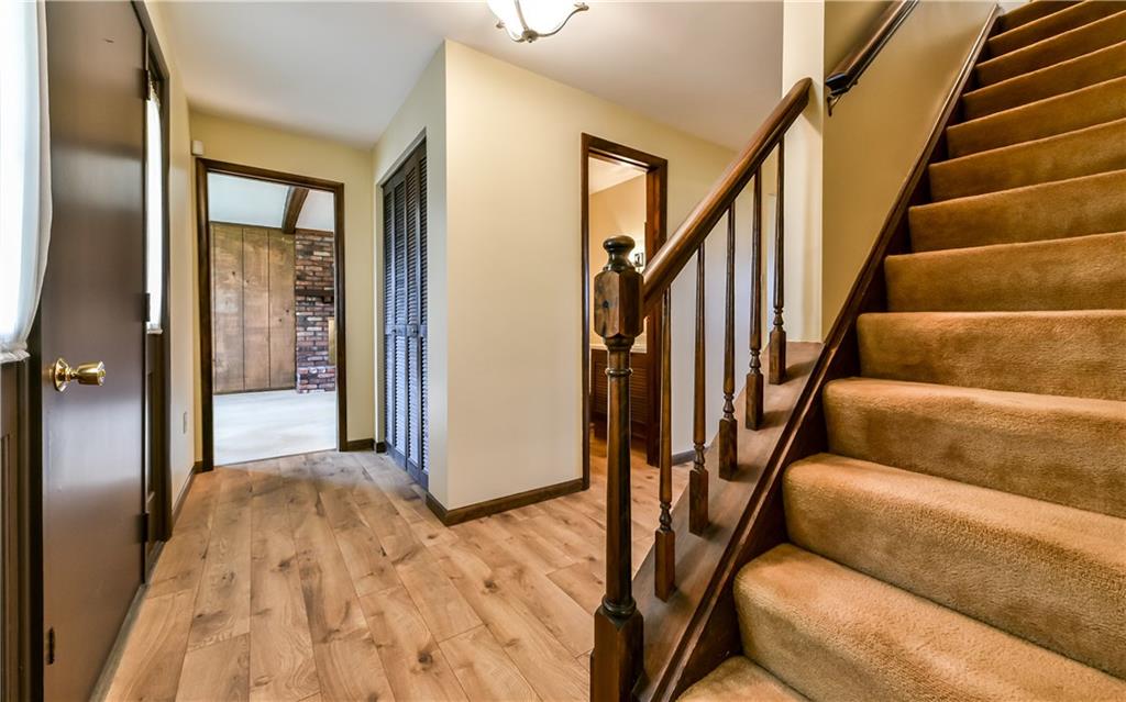 210 Woodcroft Road Economy, PA 15005 - Photo 4 of 25 Large entry with new wood plank flooring and timeless wood trim throughout.