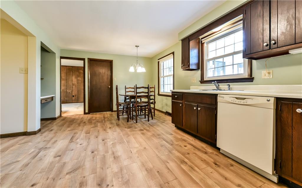 210 Woodcroft Road Economy, PA 15005 - Photo 6 of 25 Eat in kitchen with new wood plank flooring.