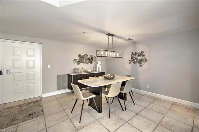 a view of a dining room that has a table and chairs
