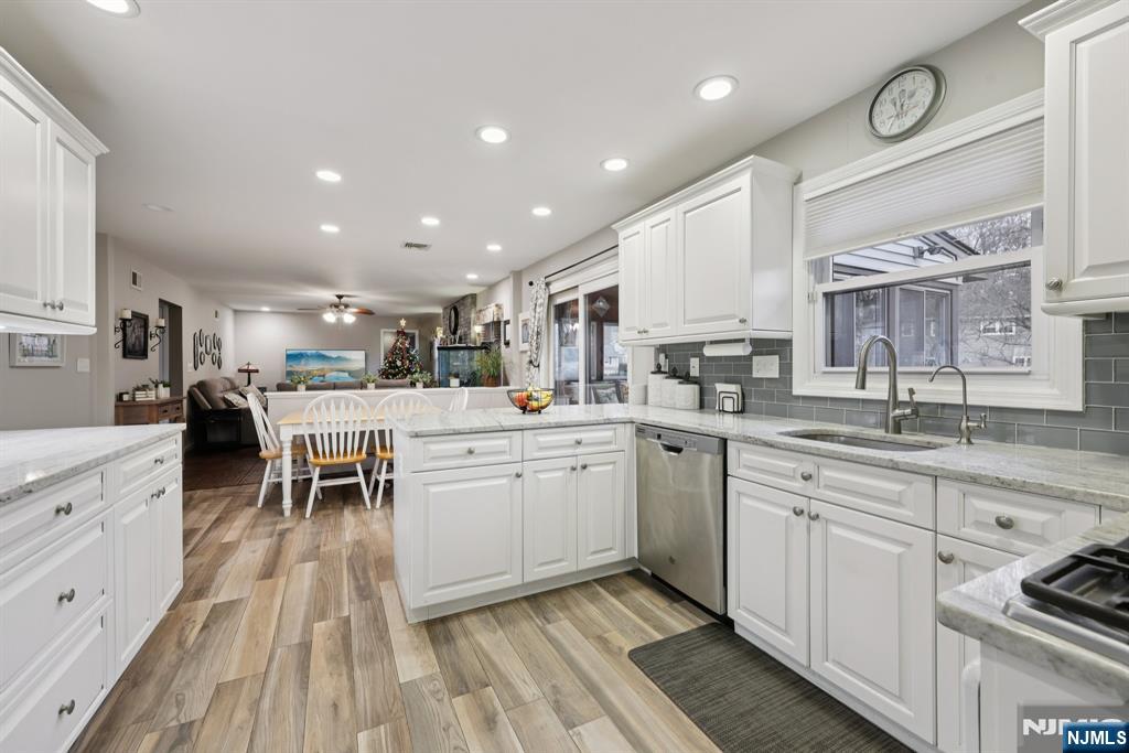 7 Welsh Court Wayne, NJ 07470 - Photo 12 of 40 a kitchen with cabinets oven and a sink