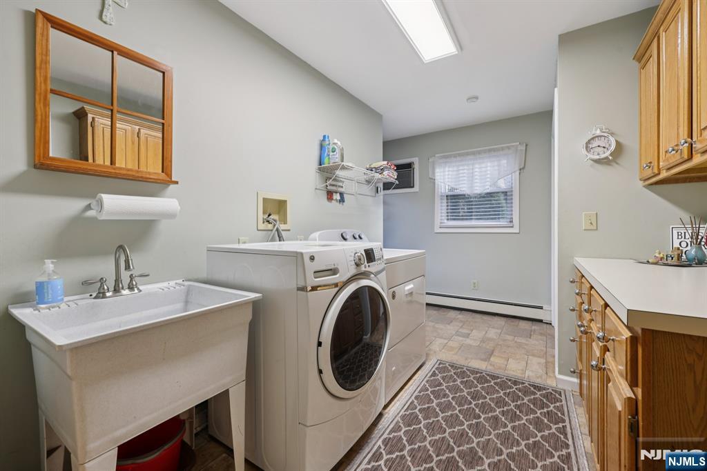 7 Welsh Court Wayne, NJ 07470 - Photo 20 of 40 a utility room with sink dryer and washer