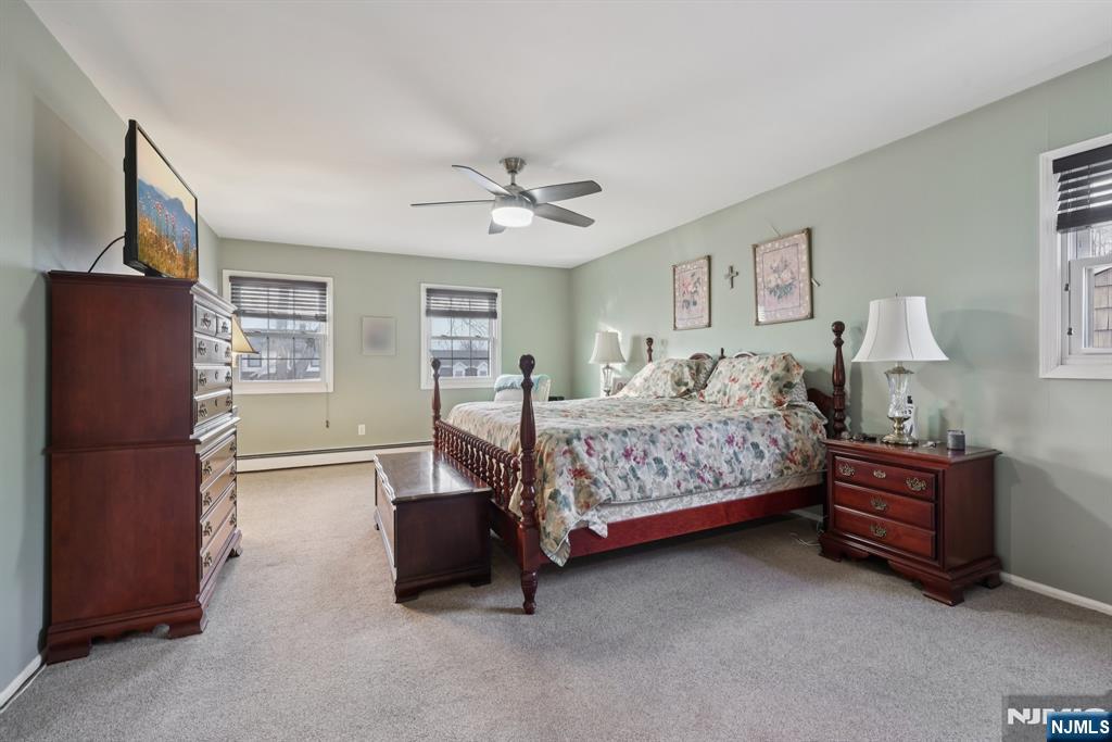 7 Welsh Court Wayne, NJ 07470 - Photo 21 of 40 a bedroom with a bed dresser and window
