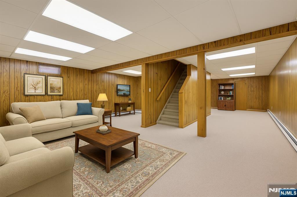 7 Welsh Court Wayne, NJ 07470 - Photo 30 of 40 a living room with furniture and a stairs