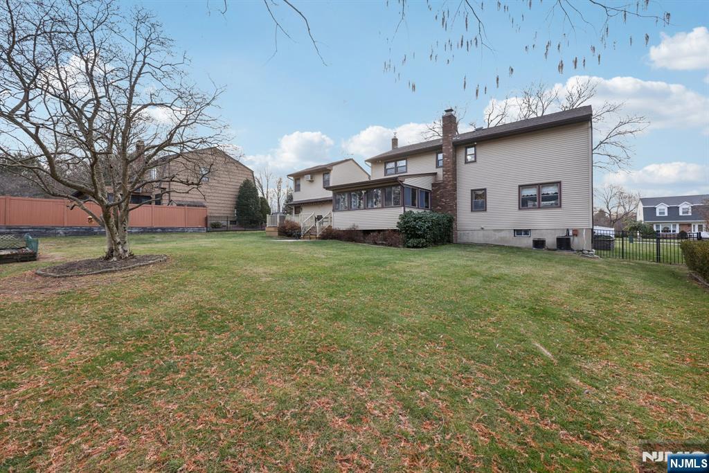 7 Welsh Court Wayne, NJ 07470 - Photo 35 of 40 a view of a house with a yard