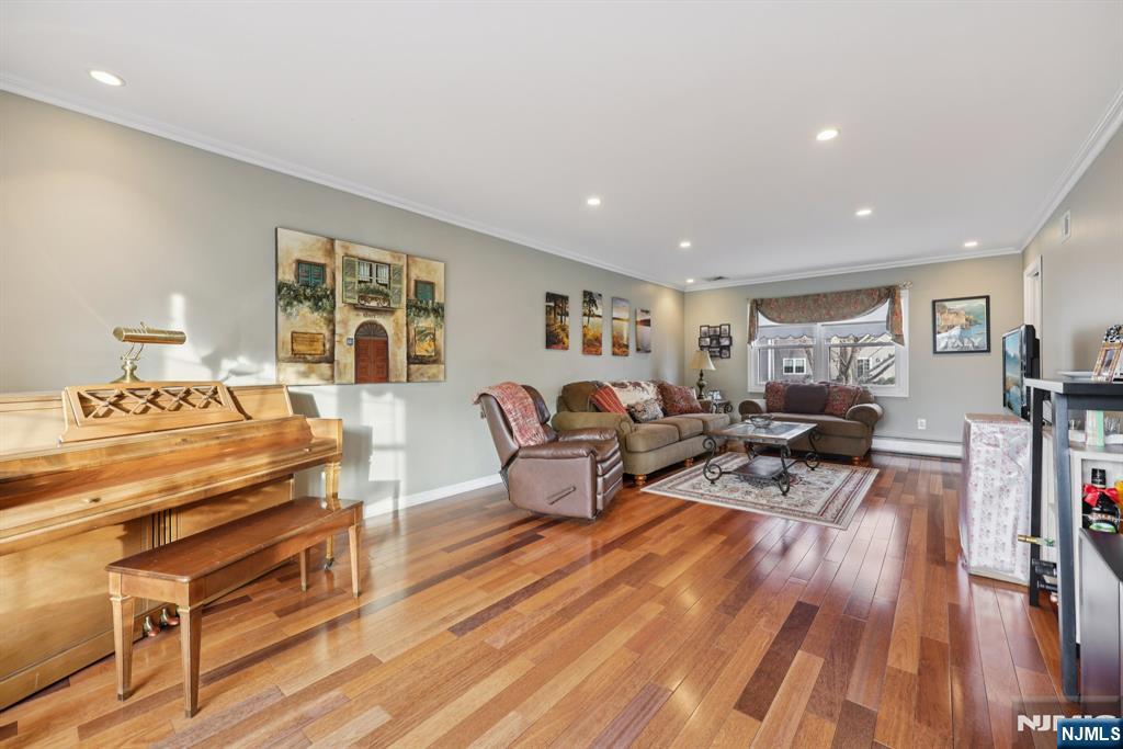 7 Welsh Court Wayne, NJ 07470 - Photo 6 of 40 a living room with furniture and a wooden floor