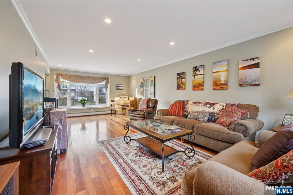 7 Welsh Court Wayne, NJ 07470 - Photo 7 of 40 a living room with furniture and a flat screen tv