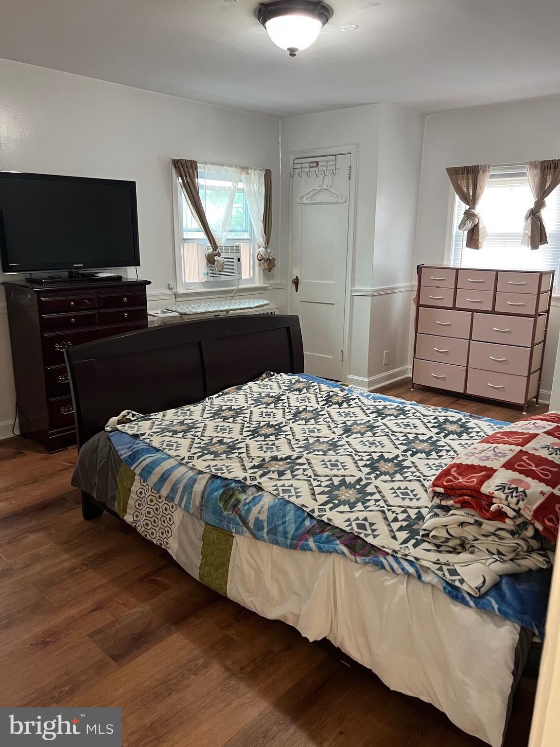 363 Sherbrook Boulevard Upper Darby, PA 19082 - Photo 11 of 22 a bedroom with a bed and a flat screen television