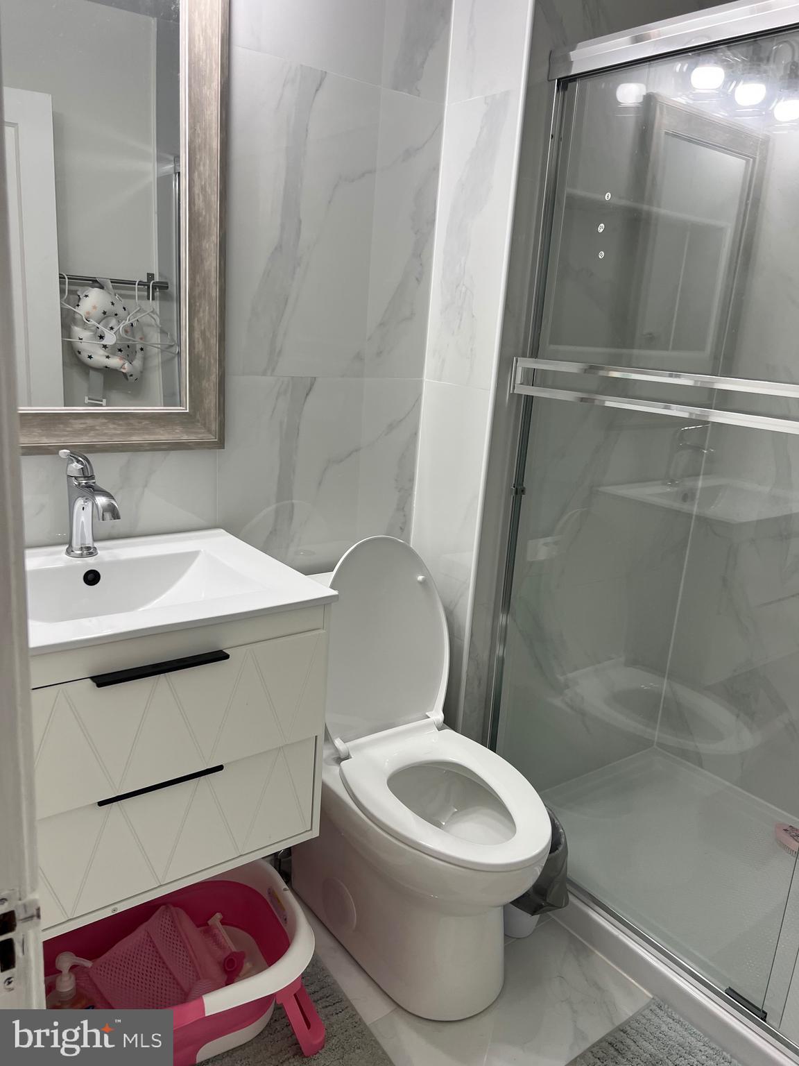 363 Sherbrook Boulevard Upper Darby, PA 19082 - Photo 16 of 22 a white toilet sitting next to a bathroom sink