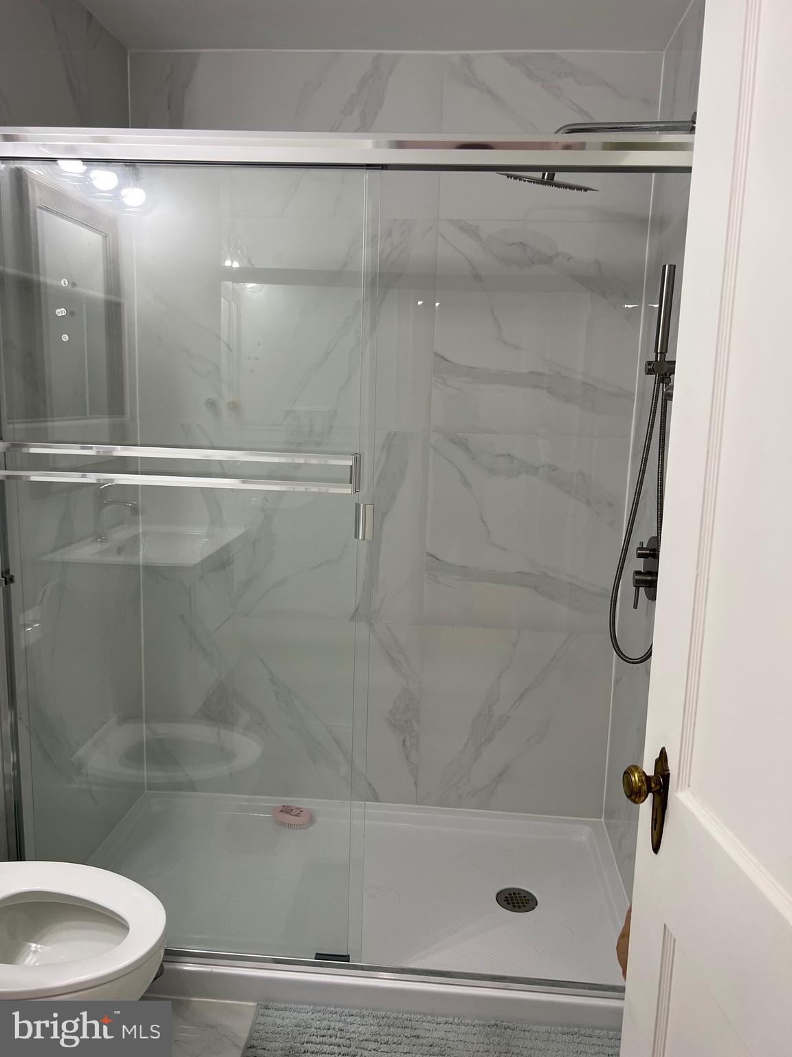 363 Sherbrook Boulevard Upper Darby, PA 19082 - Photo 17 of 22 a bathroom with a shower and a toilet