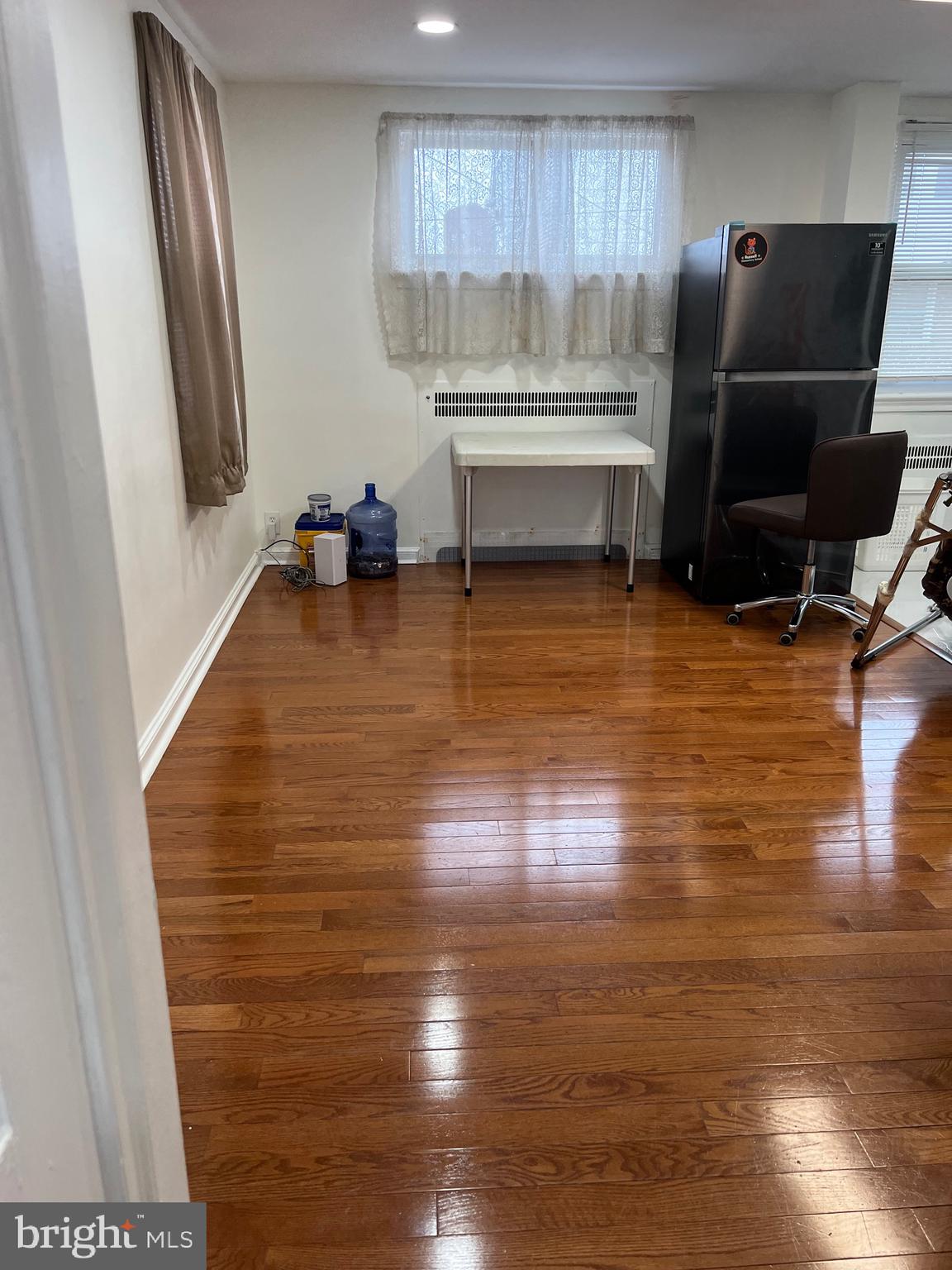 363 Sherbrook Boulevard Upper Darby, PA 19082 - Photo 5 of 22 a room with wooden floor and furniture