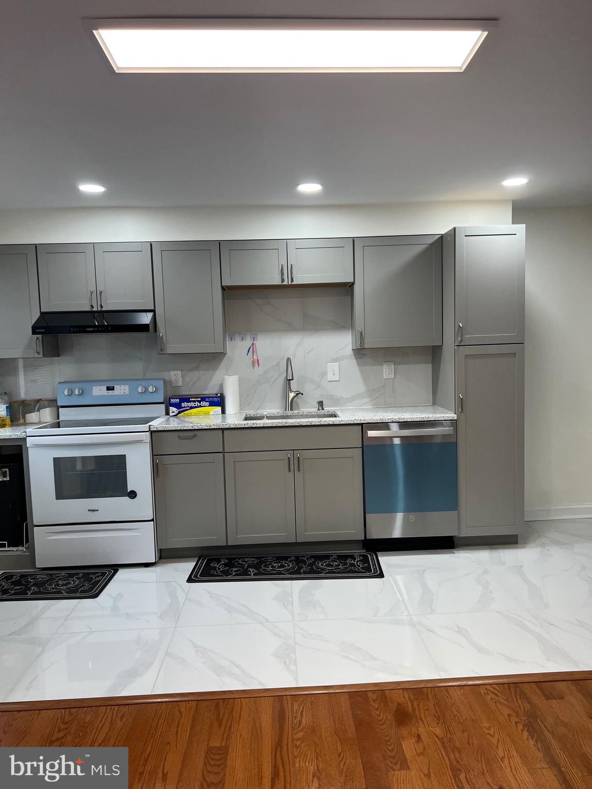 363 Sherbrook Boulevard Upper Darby, PA 19082 - Photo 9 of 22 a kitchen with kitchen island a sink stainless steel appliances and cabinets