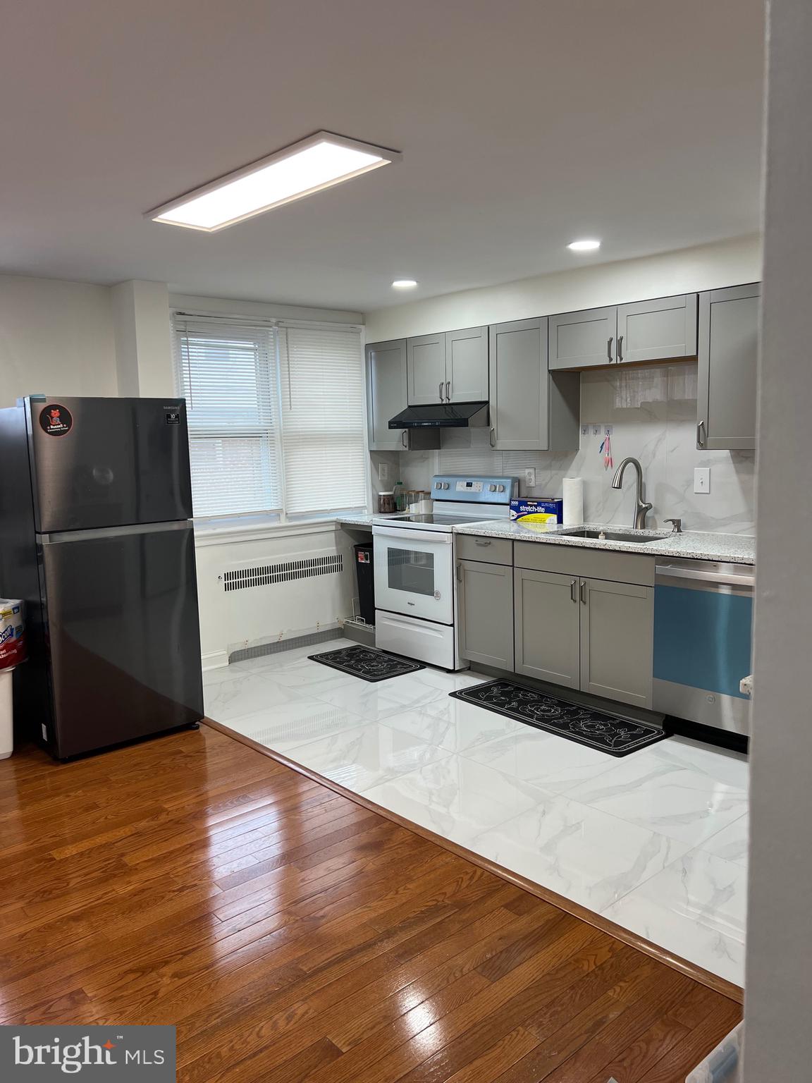363 Sherbrook Boulevard Upper Darby, PA 19082 - Photo 10 of 22 a kitchen with stainless steel appliances granite countertop a refrigerator and a stove top oven
