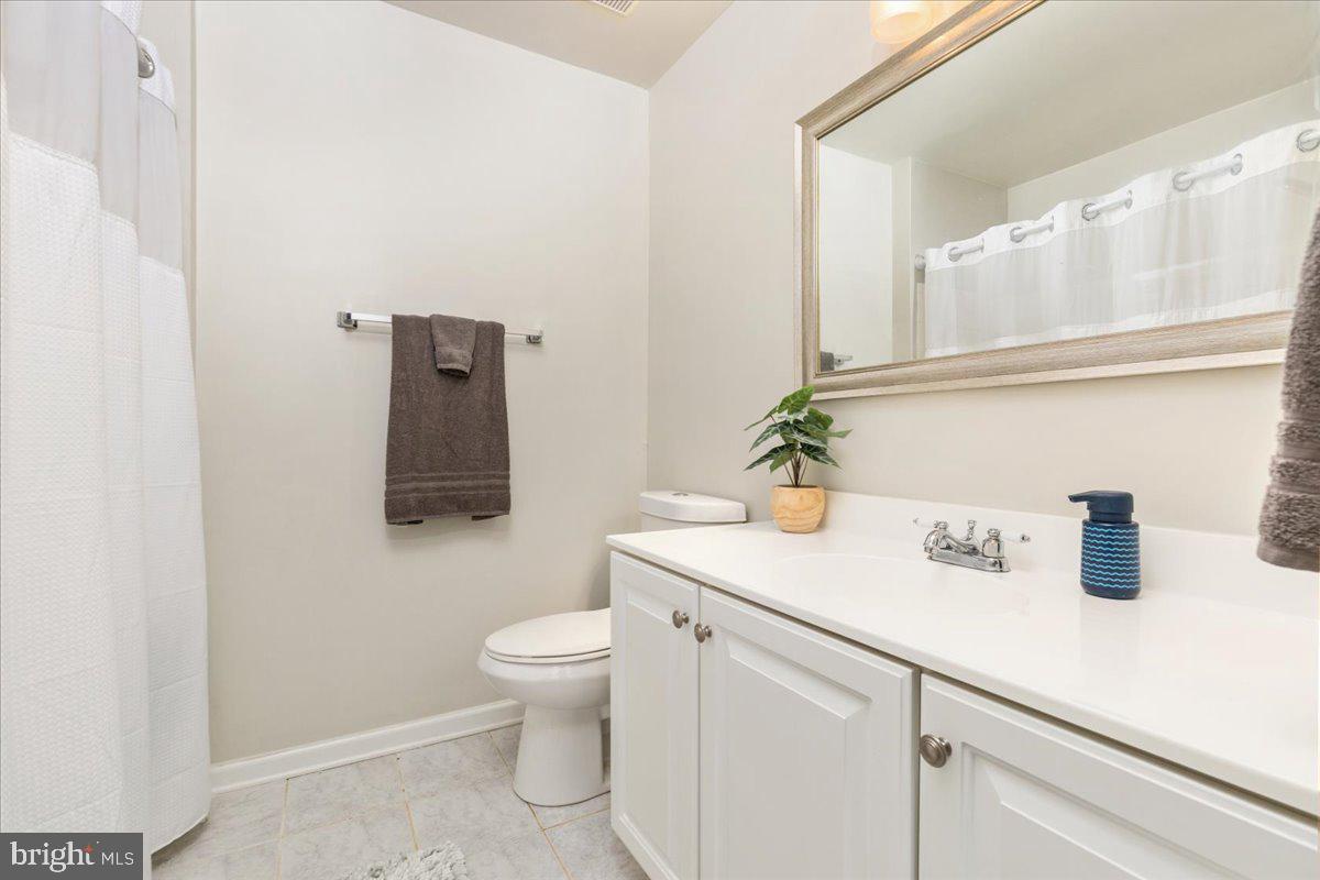 7235 Traphill Way Gainesville, VA 20155 - Photo 15 of 40 a bathroom with a sink and a mirror