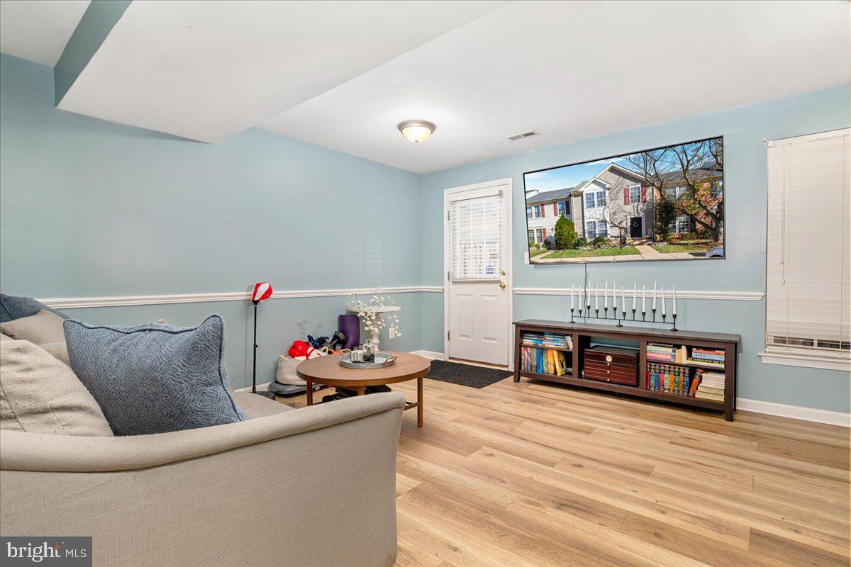 7235 Traphill Way Gainesville, VA 20155 - Photo 21 of 40 a living room with furniture and a fireplace