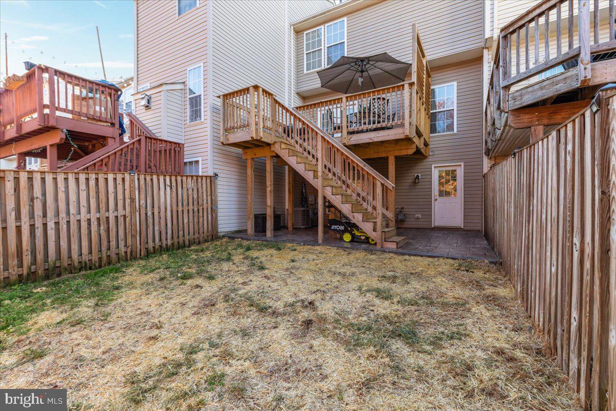 7235 Traphill Way Gainesville, VA 20155 - Photo 29 of 40 a view of a house with a yard