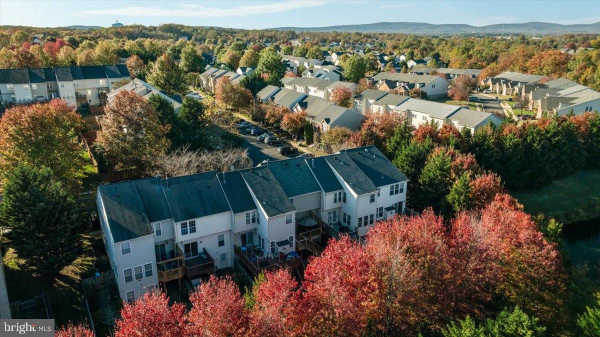 7235 Traphill Way Gainesville, VA 20155 - Photo 38 of 40 an aerial view of a house with a lake view