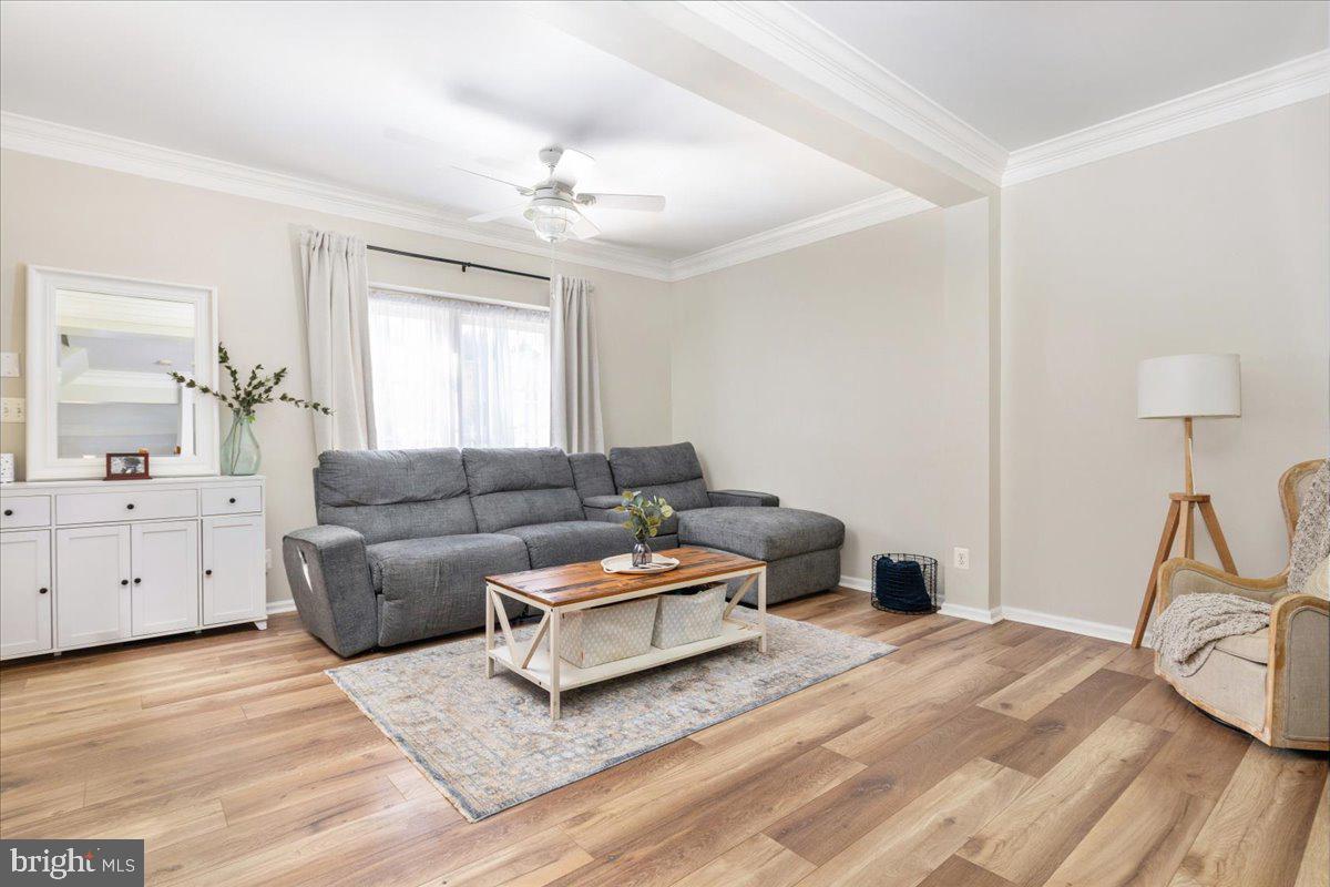 7235 Traphill Way Gainesville, VA 20155 - Photo 5 of 40 a living room with furniture and a window